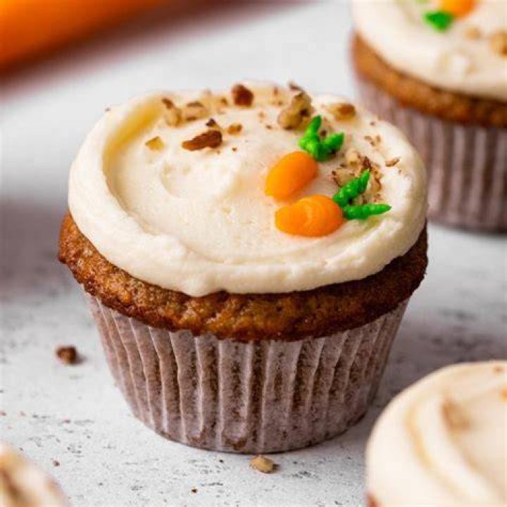 Carrot cake cupcake batter in a muffin pan.